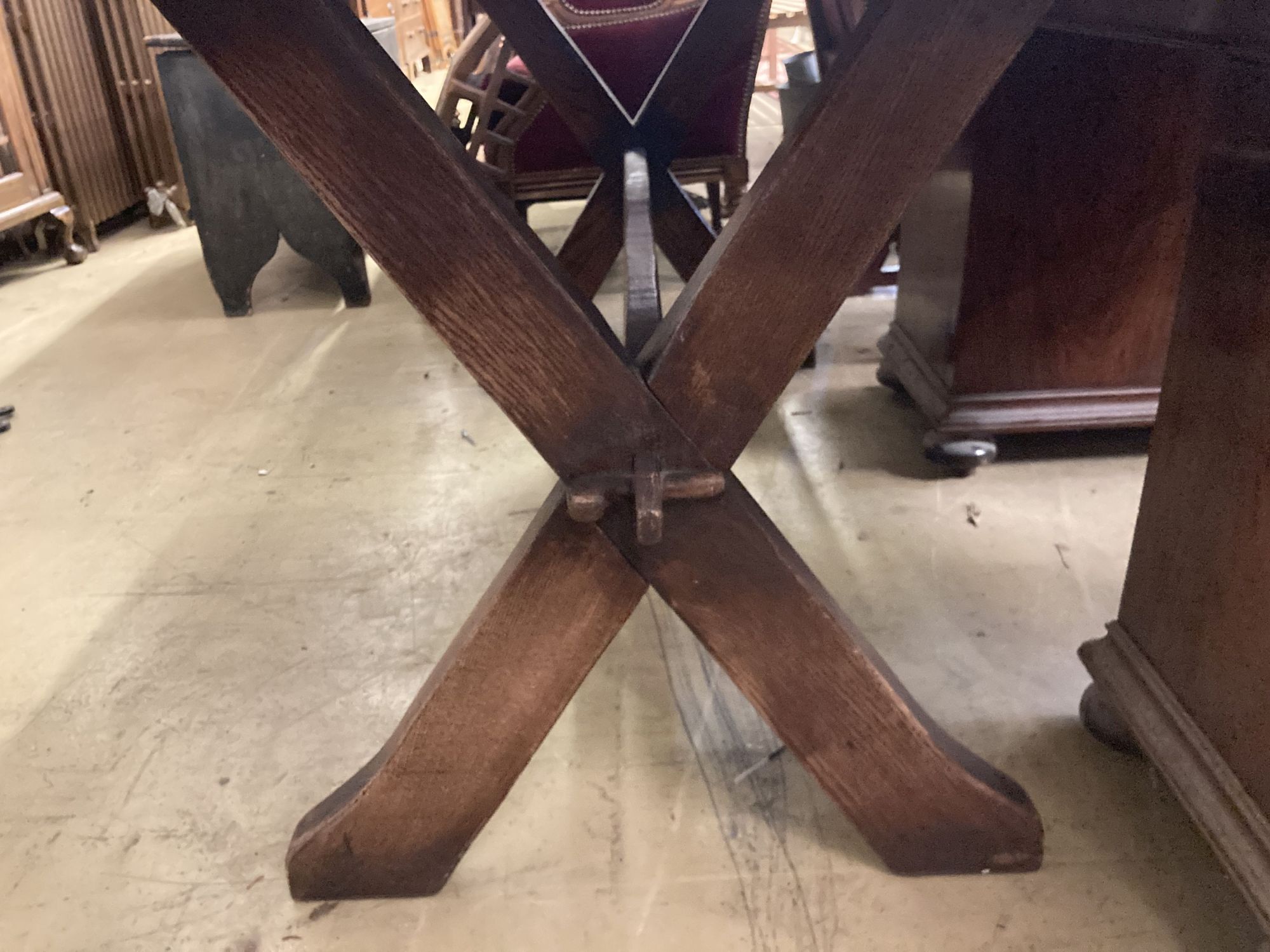 An early 20th century rectangular oak X frame refectory dining table, length 167cm, depth 80cm, height 75cm